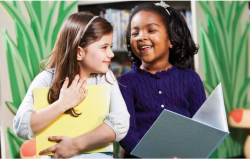 Young girls are all smiles as they learn together 